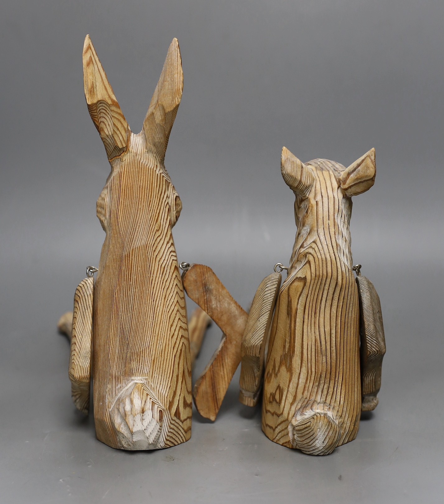 A pair of carved wood animal peg dolls, a hare and a sheep, hare tallest, 43cms high